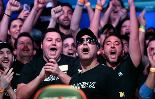 Cliff Josephy, second right, of N.Y. reacts with his supporters after winning an all-in bet against Qui Nguyen on the first hand of the night at the final table at the 2016 World Series of Poker M ...