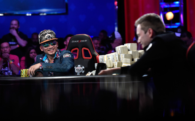 Qui Nguyen, left, of Las Vegas and Gordon Vayo of San Francisco compete during the final table at the 2016 World Series of Poker Main Event at the Rio hotel-casino, Tuesday, Nov. 1, 2016, in Las V ...