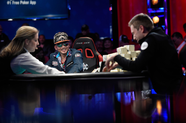 Qui Nguyen, left, of Las Vegas and Gordon Vayo of San Francisco compete during the final table at the 2016 World Series of Poker Main Event at the Rio hotel-casino, Tuesday, Nov. 1, 2016, in Las V ...