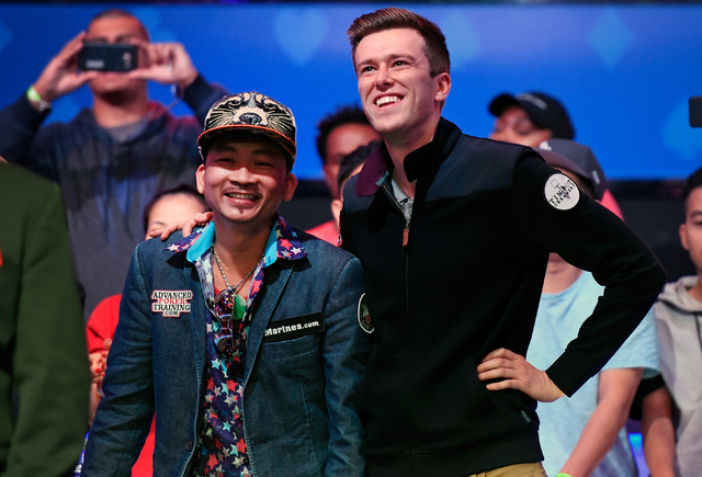 Qui Nguyen, left, of Las Vegas and Gordon Vayo of San Francisco wait for cards to be turned during the final table at the 2016 World Series of Poker Main Event at the Rio hotel-casino Wednesday, N ...