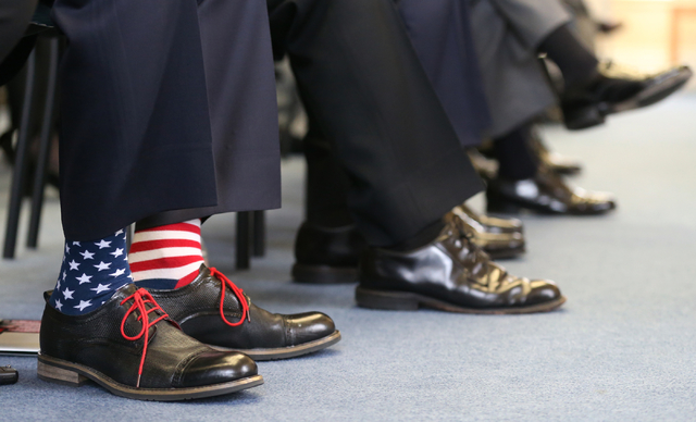 Former Navy Seal Lt. Jason Redmon sports patriotic socks for the USS Nevada Centennial Ceremony ...