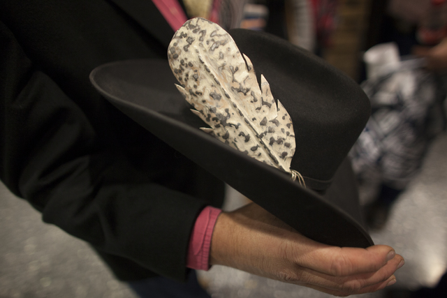 Logan Martin shows off his metal feather at the National Finals Rodeo at Thomas & Mack Cent ...