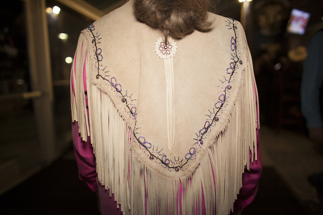 Mary Novak shows off her leather pancho at the National Finals Rodeo at Thomas & Mack Cente ...