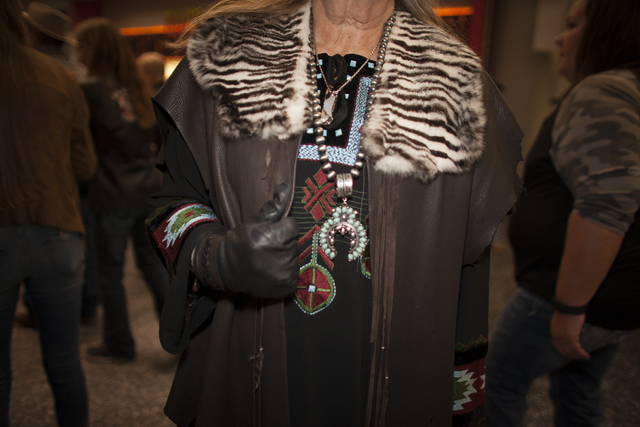 Shelly Weppler shows off her leather jacket and jewelry at the National Finals Rodeo at Thomas ...