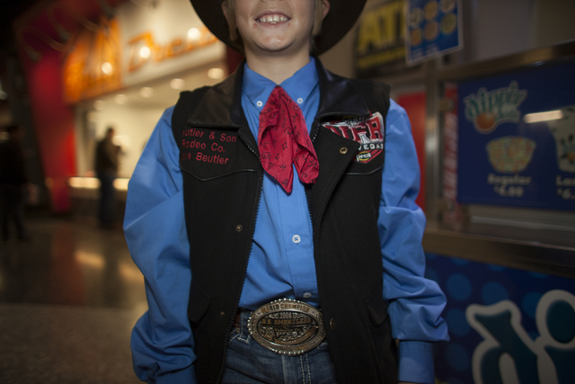 Jake Beutler shows off his vest and shirt combo at the National Finals Rodeo at Thomas & Ma ...