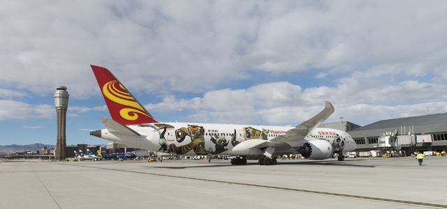 Hainan Airlines flight 7969, a Boeing 787 from Beijing, taxis to the gate at McCarran International Airport in Las Vegas to inaugurate regular nonstop service from Beijing on Friday, Dec. 2, 2016. ...