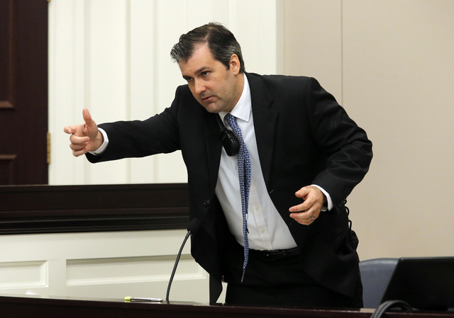 Former North Charleston police officer Michael Slager gestures as he testifies in his murder trial at the Charleston County court in Charleston, S.C., Tuesday, Nov. 29, 2016. Slager is charged wit ...
