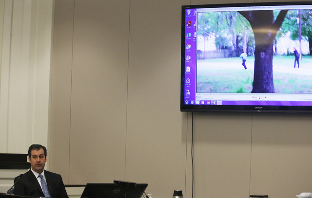 Former North Charleston police officer Michael Slager looks away from a video monitor as he testifies during his murder trial at the Charleston County court in Charleston, S.C., Tuesday, Nov. 29, ...