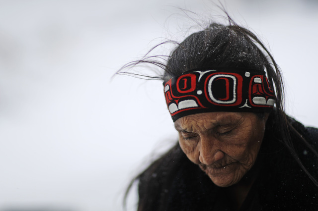 Grandma Redfeather of the Sioux Native American tribe walks in the snow to get water at the Oceti Sakowin camp where people have gathered to protest the Dakota Access oil pipeline in Cannon Ball,  ...