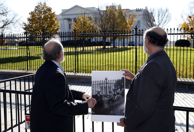 Michael, left, and Robert Meeropol, the sons of Ethel Rosenberg, pose similar to an old photograph of them, before they attempt to deliver a letter to President Barack Obama in an effort to obtain ...