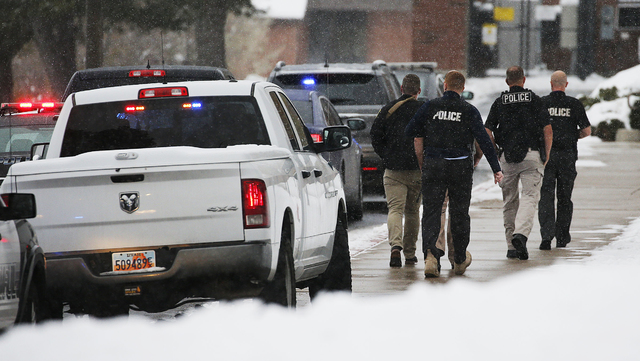 Officials respond to Mueller Park Junior High after a student fired a gun into the ceiling in Bountiful, Utah on Thursday, Dec. 1, 2016. (Ravell Call/The Deseret News via AP)