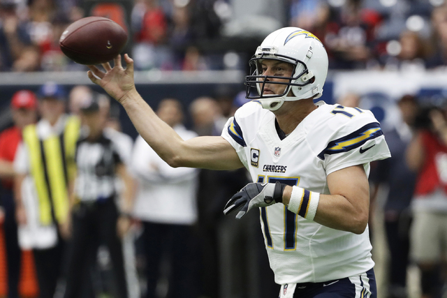 In this Sunday, Nov. 27, 2016, file photo, San Diego Chargers quarterback Philip Rivers passes against the Houston Texans during the first half of an NFL football game in Houston. The Chargers wou ...