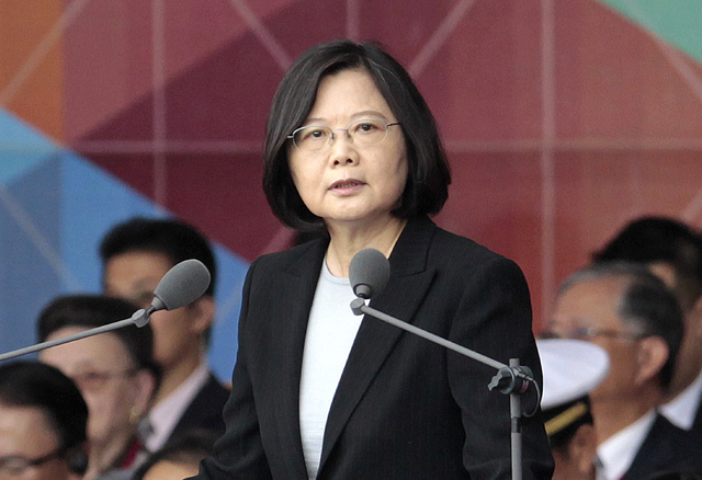 In this Oct. 10, 2016, file photo, Taiwan's President Tsai Ing-wen delivers a speech during National Day celebrations in front of the Presidential Building in Taipei, Taiwan. President-elect Donal ...