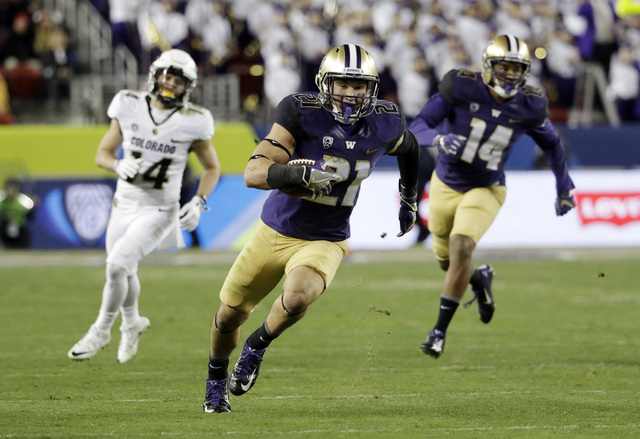 Washington defensive back Taylor Rapp (21) runs after intercepting a Colorado pass during the second half of the Pac-12 Conference championship NCAA college football game Friday, Dec. 2, 2016, in  ...