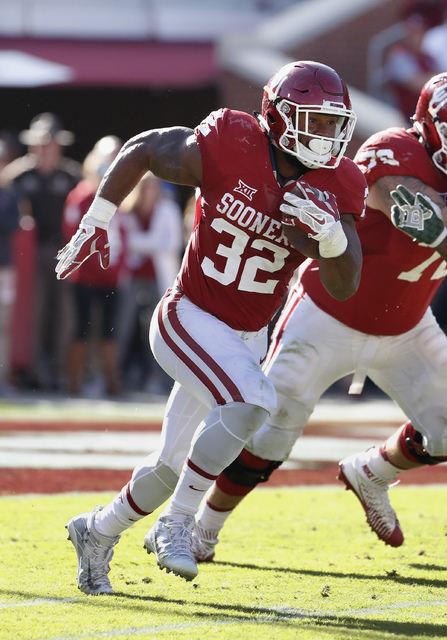 In this Saturday, Nov. 12, 2016, photo, Oklahoma running back Samaje Perine (32) runs the ball against Baylor during the second half of a NCAA college football game in Norman, Okla. (Alonzo Adams/AP)