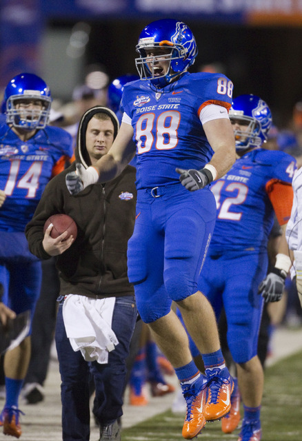 Boise State tight end Chandler Koch celebrates teammate Doug Martin's second quarter touchdown against Utah in the Maaco Bowl NCAA college football game, Wednesday Dec. 22, 2010, in Las Vegas. Boi ...
