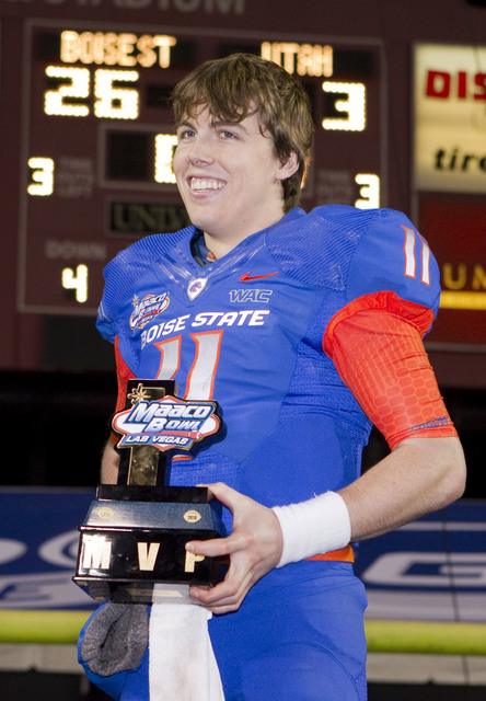 Boise State quarterback Kellen Moore celebrates being named MVP of the Maaco Bowl NCAA college football game Wednesday Dec. 22, 2010, in Las Vegas.  Boise State defeated Utah 26-3. (Eric Jamison/AP)