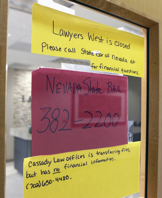 Office closure notices on the main door of Robert Graham's office at Lawyers West on 10000 W. Charleston Blvd. Friday, Dec. 9, 2016, in Las Vegas. Graham has abandoned his law practice and stolen ...