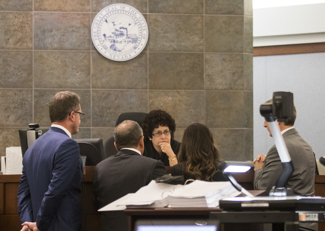 Attorneys approach judge Elissa Cadish during a death penalty trial for Norman Belcher at the Regional Justice Center in Las Vegas, on Friday, Dec. 2, 2016. Belcher, 41, is charged with killing hi ...