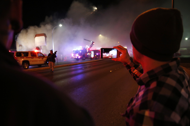 Las Vegas Fire & Rescue crews attack a two-alarm fire near Charleston Boulevard and 3rd Street in Las Vegas on Friday, Dec. 2, 2016. More than 60 firefighters responded. (Rachel Crosby/Las Veg ...