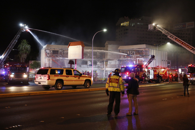 Las Vegas Fire & Rescue crews attack a two-alarm fire near Charleston Boulevard and 3rd Street in Las Vegas on Friday, Dec. 2, 2016. More than 60 firefighters responded. (Rachel Crosby/Las Veg ...