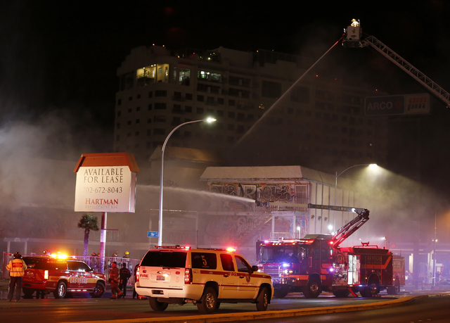 Las Vegas Fire & Rescue crews attack a two-alarm fire near Charleston Boulevard and 3rd Street in Las Vegas on Friday, Dec. 2, 2016. More than 60 firefighters responded. (Rachel Crosby/Las Veg ...