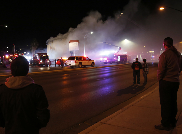 Las Vegas Fire & Rescue crews attack a two-alarm fire near Charleston Boulevard and 3rd Street in Las Vegas on Friday, Dec. 2, 2016. More than 60 firefighters responded. (Rachel Crosby/Las Veg ...