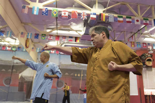 Rabbi Felipe Goodman, right, is given a kung fu lesson from shifu Shi Xing Wei at Shaolin Kungfu Chan in Las Vegas Friday, July 29, 2016. Rabbi Goodman does kung fu as a way to relieve workplace s ...