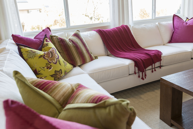 THINKSTOCK
The colorful pillows and throw boost the appeal of this otherwise plain sofa.