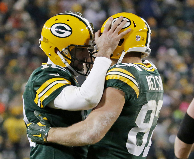 In this Dec. 11, 2016, file photo, Green Bay Packers' Aaron Rodgers congratulates Jordy Nelson after a touchdown catch during the second half of an NFL football game against the Seattle Seahawks,  ...