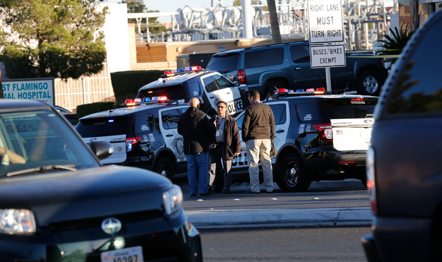 Police officers investigate in front of West Flamingo Animal Hospital in Las Vegas, Monday, Dec. 19, 2016, after an officer-involved shooting(Chitose Suzuki/Las Vegas Review-Journal) @chitosephoto | Las Vegas Review-Journal Police officers investigate in front of West Flamingo Animal Hospital in Las Vegas, Monday, Dec. 19, 2016, after an officer-involved shooting(Chitose Suzuki/Las Vegas Review-Journal) @chitosephoto | Las Vegas Review-Journal