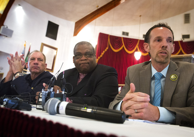 Nevadans for Background check backers from left Bill Young,former Clark County Sheriff,  Dr. Robert E. Fowler, pastor, Victory Missionary Baptist Church, and Justin Jones, Nevada State Senator   d ...