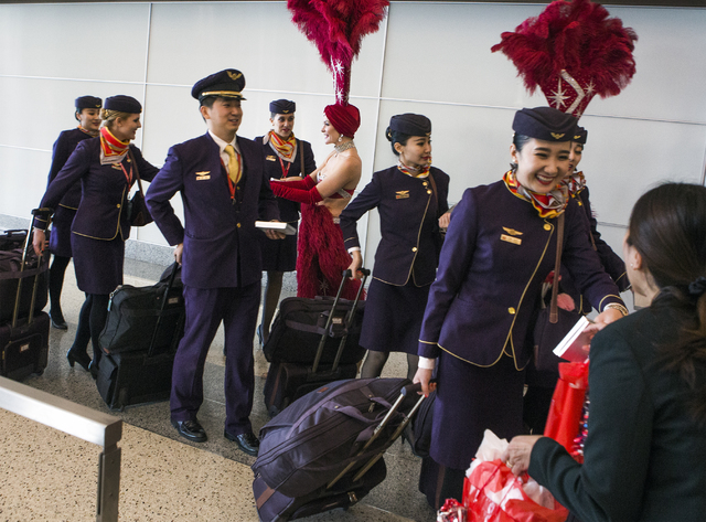 Hainan Airlines flight crew from Beijing receive gifts after arriving at McCarran International Airport on Friday, Dec. 2, 2016. The first nonstop flight from China arrived on Friday. Jeff Scheid/ ...