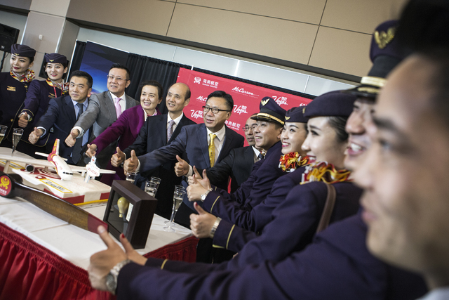Hainan Airlines flight and dignitaries give a thumps up during an inaugural reception at McCarran International Airport on Friday, Dec. 2, 2016. The first nonstop flight from China arrived on Frid ...
