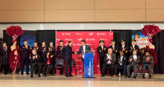 Ambassador Luo LiQuan of the San Francisco Consulate of the People's Republic of China is greeted Hou Wei, senior vice president of Hainan Airlines as they gather with city and county officials to ...