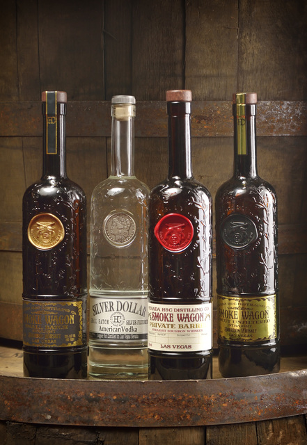 Three iterations of award-winning Smoke Wagon bourbon and Silver Dollar vodka from the Nevada H & C Distilling Co. are displayed in the warehouse. Bill Hughes/Las Vegas Review-Journal
