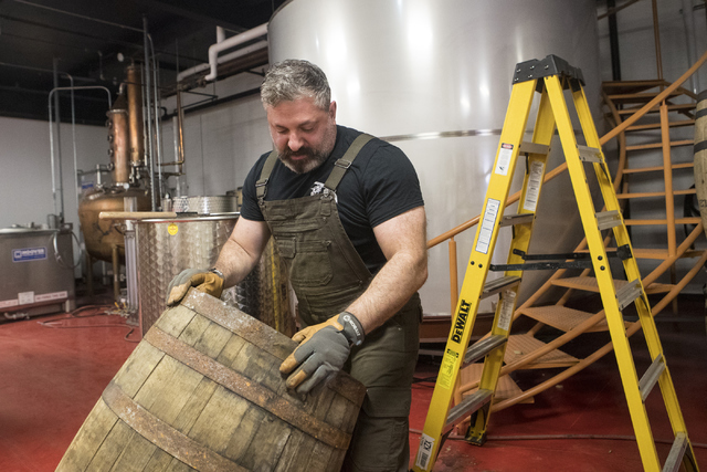 Co-owner of the Nevada H&C Distilling Co., Aaron Chepenik, moves one of the bourbon barrels to the forklift on Tuesday, Oct. 18, 2016, in Las Vegas. Loren Townsley/Las Vegas Review-Journal Fol ...