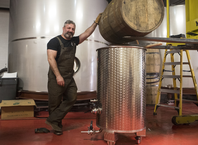 Co-owner of the Nevada H&C Distilling Co., Aaron Chepenik, poses next to one of his bourbon barrels on Tuesday, Oct. 18, 2016, in Las Vegas. Loren Townsley/Las Vegas Review-Journal Follow @lor ...