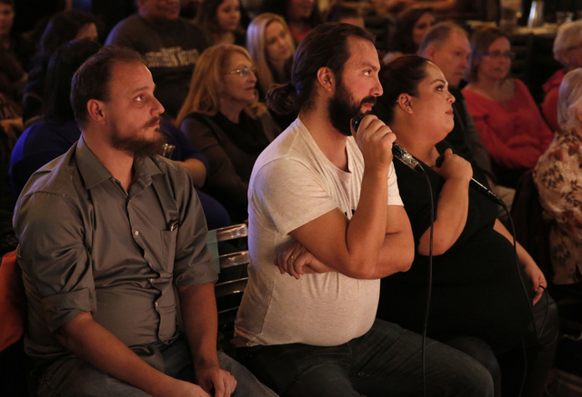 Interpreter Anthony Adomo, center, watches a performance during ASL SLAM at E-String Grill and Poker Bar in Henderson on Dec. 3, 2016. ASL SLAM is a space for Deaf performing artists to share poet ...