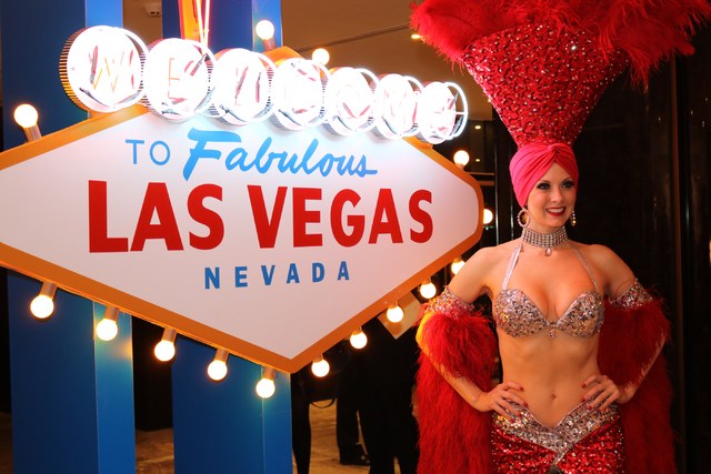 Las Vegas showgirl Jennifer Autry poses for photos during a launch party for Hainan Airlines' nonstop service from Beijing to Las Vegas. Hainan Airlines. The LVCVA hosted the launch party at The P ...