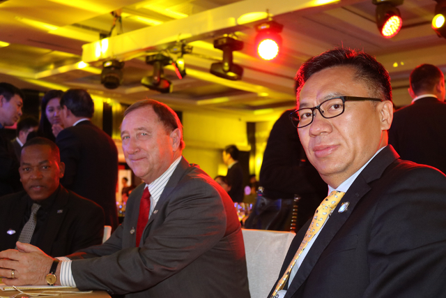 Commissioner Lawrence Weekly, left, Las Vegas Convention and Visitors Authority President and CEO Rossi Ralenkotter, and Senior Vice President of Hainan Airlines Hou Wei enjoy a launch party for H ...