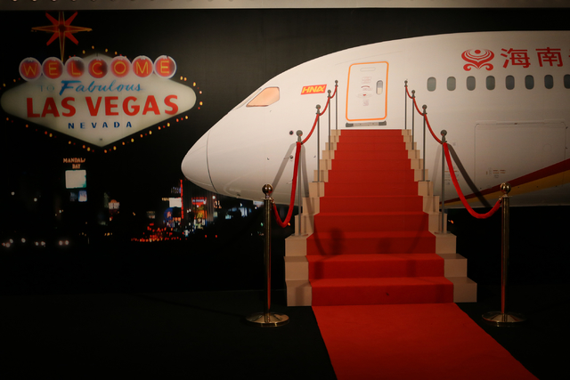 A backdrop of a stairway into a Hainan Airlines plane invites guests to pose for pictures during a launch party for Hainan Airlines' nonstop service from Beijing to Las Vegas. Hainan Airlines and  ...