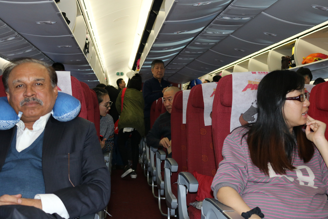 Passengers of the inaugural Hainan Airlines flight from Beijing to Las Vegas board the airplane at Beijing International Airport Friday, Dec. 2, 2016. (Nicole Raz/Las Vegas Review-Journal)