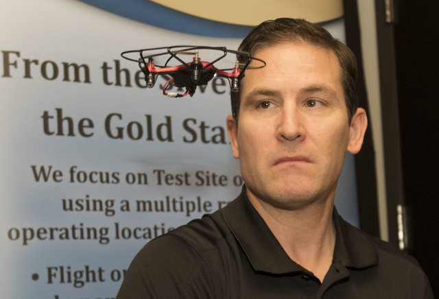 Dr. Chris Walach, director of operations of unmanned aviation for Nevada Institute for Autonomous Systems, flies a small drone during a flight demonstration at his office in Las Vegas on Wednesday ...