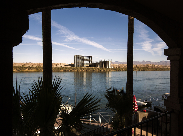 The abandoned Emerald River resort tower is seen in the background at Susan Martinolich's home in Bullhead City, Ariz. on Tuesday, Dec. 6, 2016. The project has been shut down for almost 30 years. ...