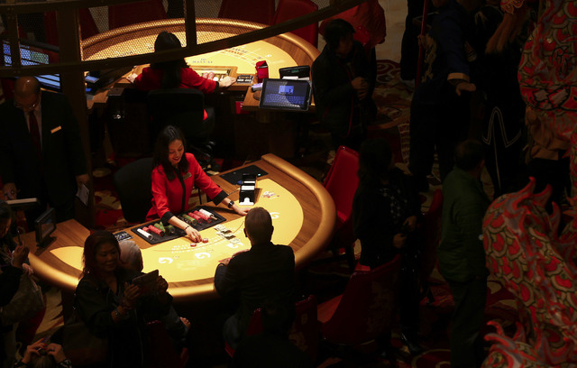 People gamble during the grand opening of the Lucky Dragon hotel-casino in Las Vegas on Saturday, Dec. 3, 2016. (Chase Stevens/Las Vegas Review-Journal) @csstevensphoto