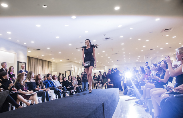 Models walk the runway at Saks Fifth Avenue on Thursday, Nov. 17, 2016, at Fashion Show Mall, in Las Vegas. The event, titled &quot;Little Black Dress,&quot; was a student design competiti ...