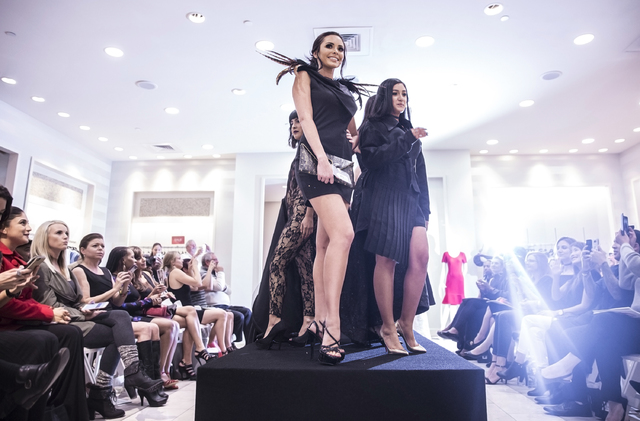 Models walk the runway at Saks Fifth Avenue on Thursday, Nov. 17, 2016, at Fashion Show Mall, in Las Vegas. The event, titled &quot;Little Black Dress,&quot; was a student design competiti ...