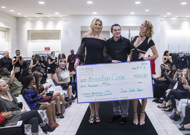 Carrie Carter Cooper, left, Brenton Coon and Katharine Taylor celebrate winning the &quot;Little Black Dress&quot; event at Saks Fifth Avenue on Thursday, Nov. 17, 2016, at Fashion Show Ma ...