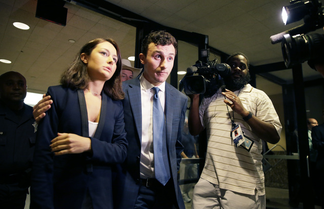 Former Cleveland Browns quarterback Johnny Manziel, right, and his sister Meri Manziel  leave after he made his initial court appearance, Thursday, May 5, 2016, in Dallas. (LM Otero/AP)